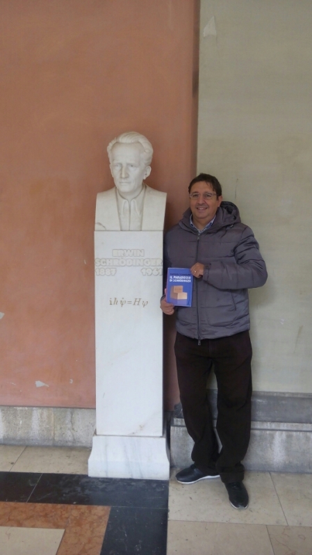 At Vienna University with my book and Schrodinger's statue.jpg